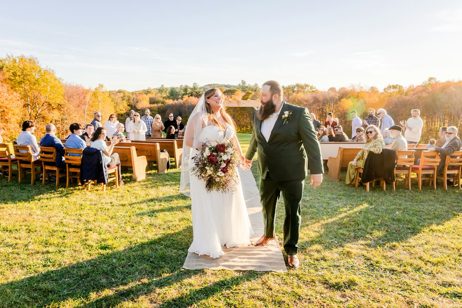 Guests at an outdoor reception in late afternoon light
