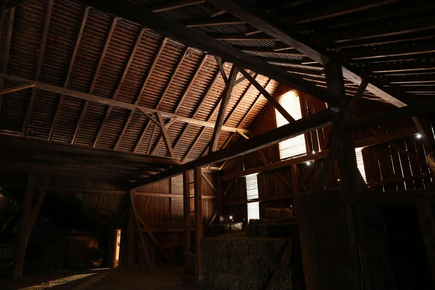 Inside the timber-framed barn set for a wedding breakfast